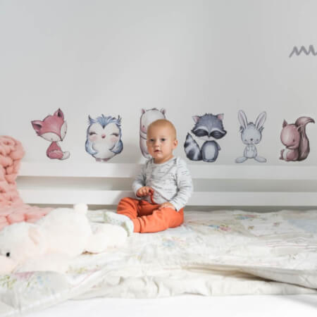 Animal stickers over a crib
